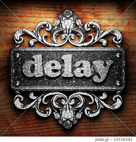 delay word of iron on wooden background 14556392