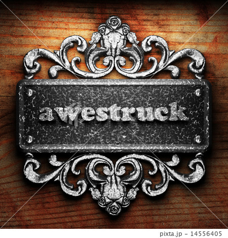 awestruck word of iron on wooden background 14556405