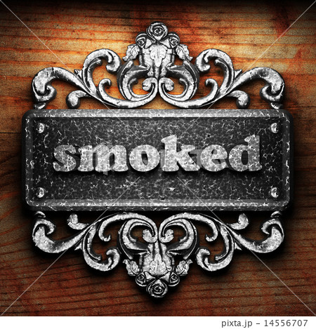 smoked word of iron on wooden background smoked word of iron on wooden background 14556707