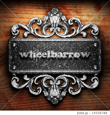 wheelbarrow word of iron on wooden background 14556788
