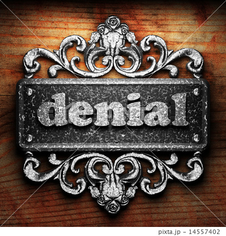 denial word of iron on wooden background denial word of iron on wooden background 14557402