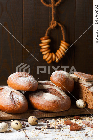 Variety of rye bread on a wooden background with milk 14560392