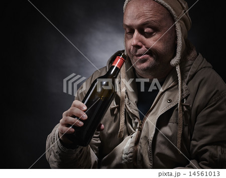 Middle aged alcoholic and wine bottle Middle aged alcoholic and wine bottle 14561013