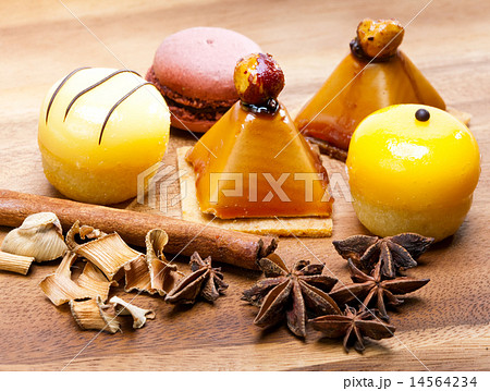Small cakes on a wooden tray Small cakes on a wooden tray 14564234