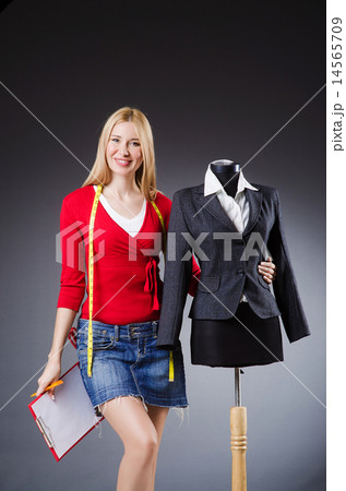 Woman tailor working on clothing Woman tailor working on clothing 14565709