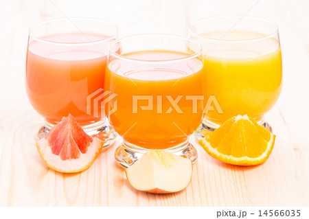 Various fresh juice in glass on wooden table. Various fresh juice in glass on wooden table. 14566035