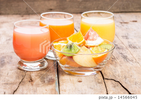 Fresh juice with fruit salad in glass dish Fresh juice with fruit salad in glass dish 14566045
