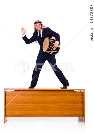 Arab businessman playing drum on desk Arab businessman playing drum on desk 14578887