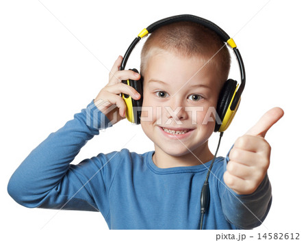 Young boy in headphones Young boy in headphones 14582612