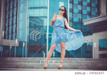 pretty woman is walking in the city 14582837