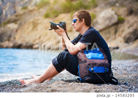photographer is taking a photo at the beach 14583205