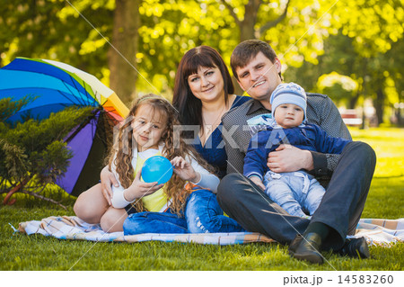 Happy family are plaing in the park 14583260