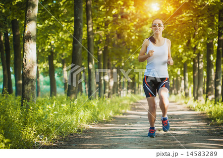 Young woman jogging in nature Young woman jogging in nature 14583289