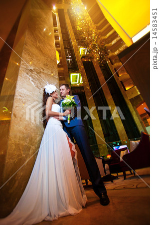 happy bride and groom in the modern hotel hall 14583451