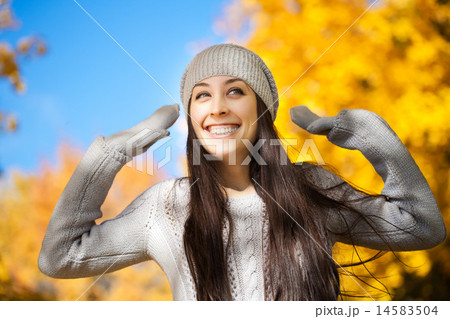 cheerfu woman on a autumn sky background cheerfu woman on a autumn sky background 14583504