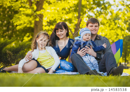 Happy family are plaing in the park 14583538