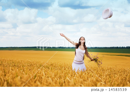 girl with white hat enjoying the wonderful weather 14583539
