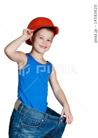 little boy with hard hat and in too big jeans 14583620