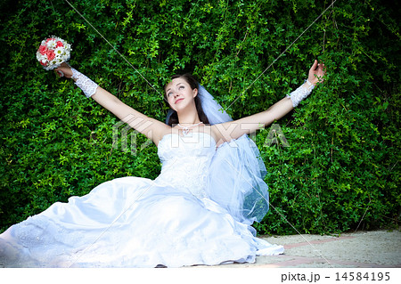 Bride is resting with outstretched arms 14584195