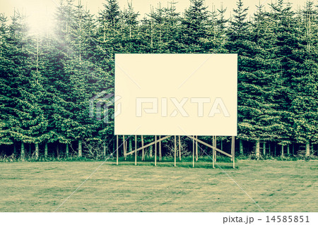 Big billboard sign surrounded by trees 14585851
