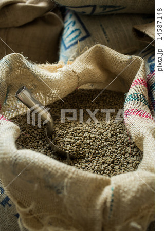 Green coffee beans in coffee bag in roasting room 14587148