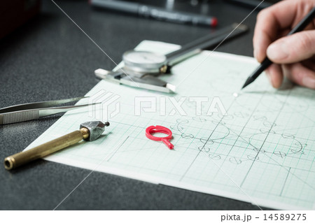 Jewelry designer works on a hand drawing sketch Jewelry designer works on a hand drawing sketch 14589275