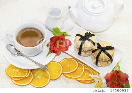 cookies and tea on a table in a restaurant cookies and tea on a table in a restaurant 14590957