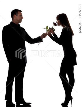 one couple man offering rose flower and woman smelling silhouett one couple man offering rose flower and woman smelling silhouett 14592052