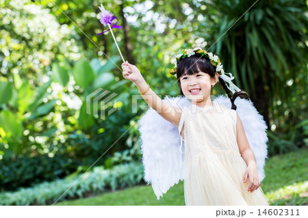 Little cute girl in angel dress in the park Little cute girl in angel dress in the park 14602311