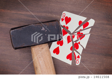 Hammer with a broken card, nine of hearts 14611508