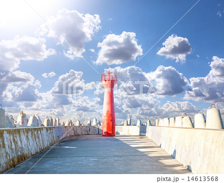 Photo of a lighthouse and concrete breakwater. Photo of a lighthouse and concrete breakwater. 14613568