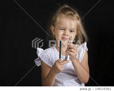 Disheveled girl looks at compass 14614561