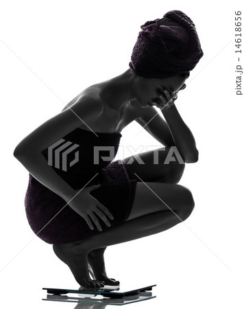 beautiful asian young woman despair on weight scale silhouette beautiful asian young woman despair on weight scale silhouette 14618656