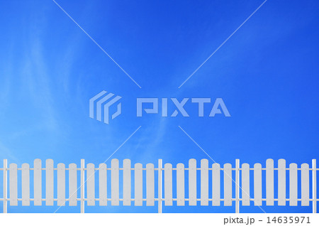 white fence and blue sky 14635971