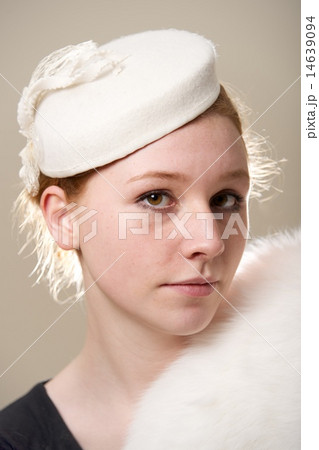 Redhead in white felt hat and fur Redhead in white felt hat and fur 14639094