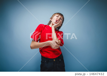 boy teenager European appearance holds a hand on the cheek wrink boy teenager European appearance holds a hand on the cheek wrink 14647432