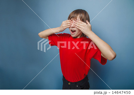 boy in red t-shirt teenager brown hair European appearance close 14647450