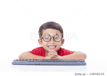 Cute Boy using a keyboard Cute Boy using a keyboard 14648220