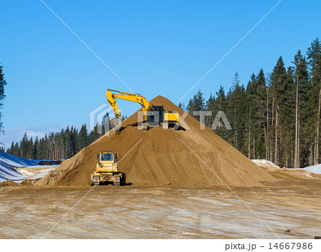 Yellow excavator at work 14667986