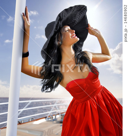 beautiful woman in red dress on the yacht 14680902