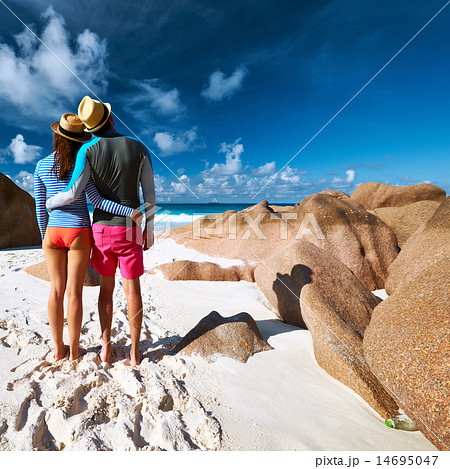 Couple at tropical beach wearing rash guard Couple at tropical beach wearing rash guard 14695047