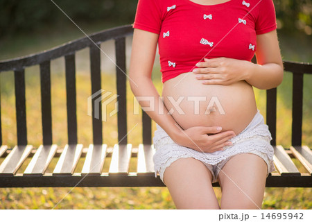 Image of pregnant woman touching her belly with hands 14695942