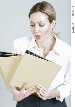 Business woman juggling folders 14696610