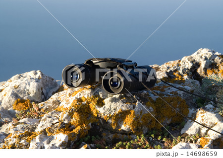Binoculars on the rock 14698659