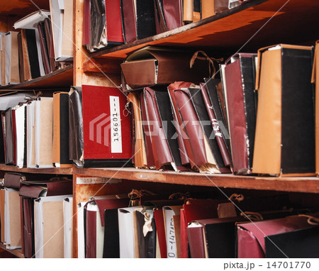 Paper documents stacked in archive Paper documents stacked in archive 14701770