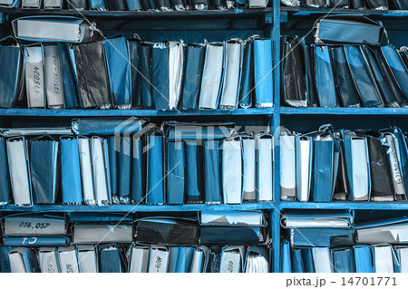 Paper documents stacked in archive 14701771