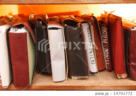 Paper documents stacked in archive Paper documents stacked in archive 14701772