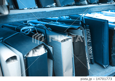 Paper documents stacked in archive 14701773