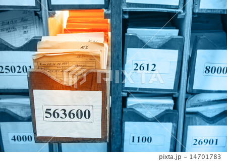 Paper documents stacked in archive 14701783