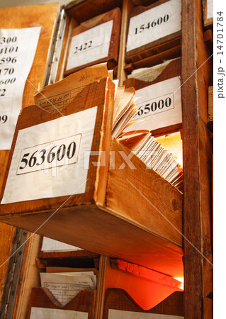 Paper documents stacked in archive Paper documents stacked in archive 14701784